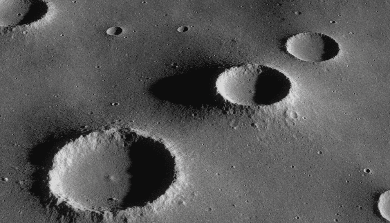 Low sunlight raking across overlapping craters along the lunar terminator