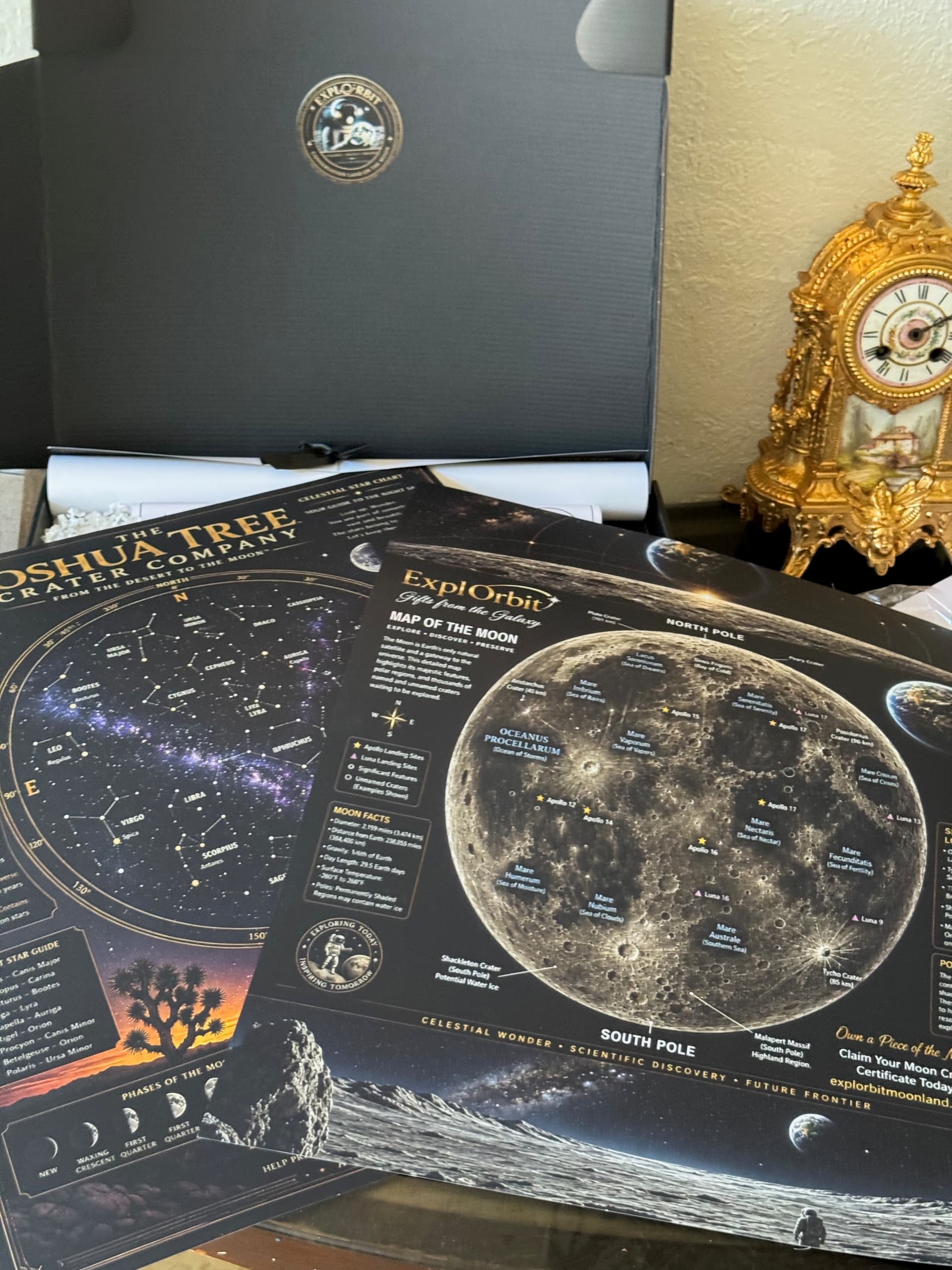 The Joshua Tree Crater Company star chart poster beside the Moon Map, showing constellations, the bright star guide, the lunar maria and the Apollo landing sites